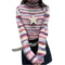 Striped turtleneck sweater styled with a star pendant necklace for a trendy look