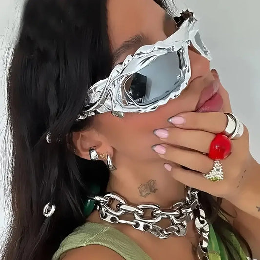 Futuristic silver eye mask with angular design for Unique Sunglasses featuring plastic lenses