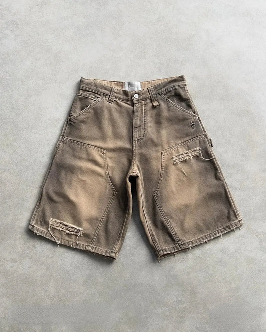 Distressed khaki denim utility cargo shorts with visible wear and tear on display