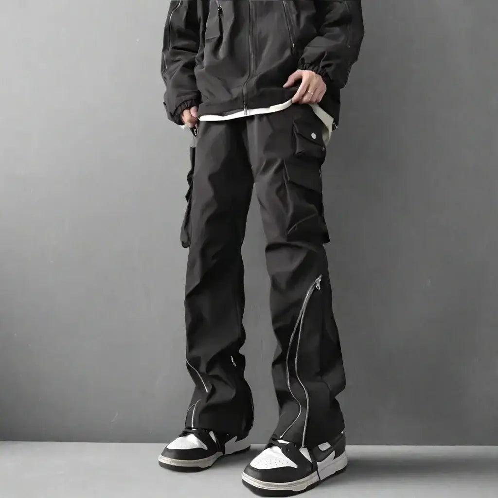 Dark loose fit Utility Pants featuring zippered pockets and a contrasting waistband