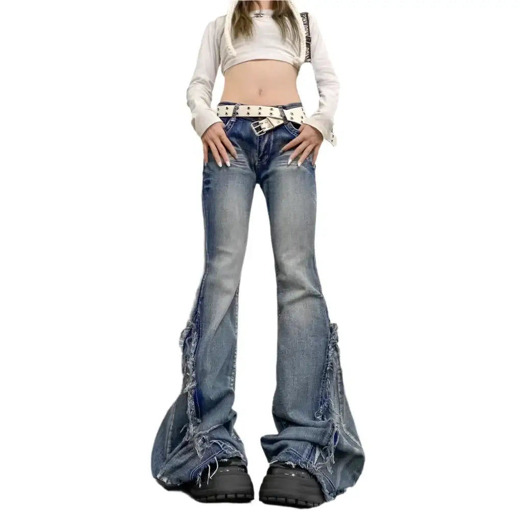 Pair of vintage flare jeans with an exaggerated bell-bottom silhouette in blue