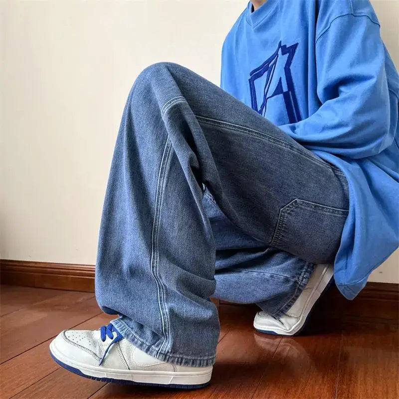 Person in baggy blue wide-leg jeans, blue sweatshirt, and white sneakers for Y2K style game