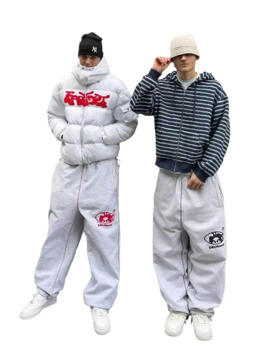 Two people in casual streetwear showcasing stylish wide leg sweatpants with cartoon designs