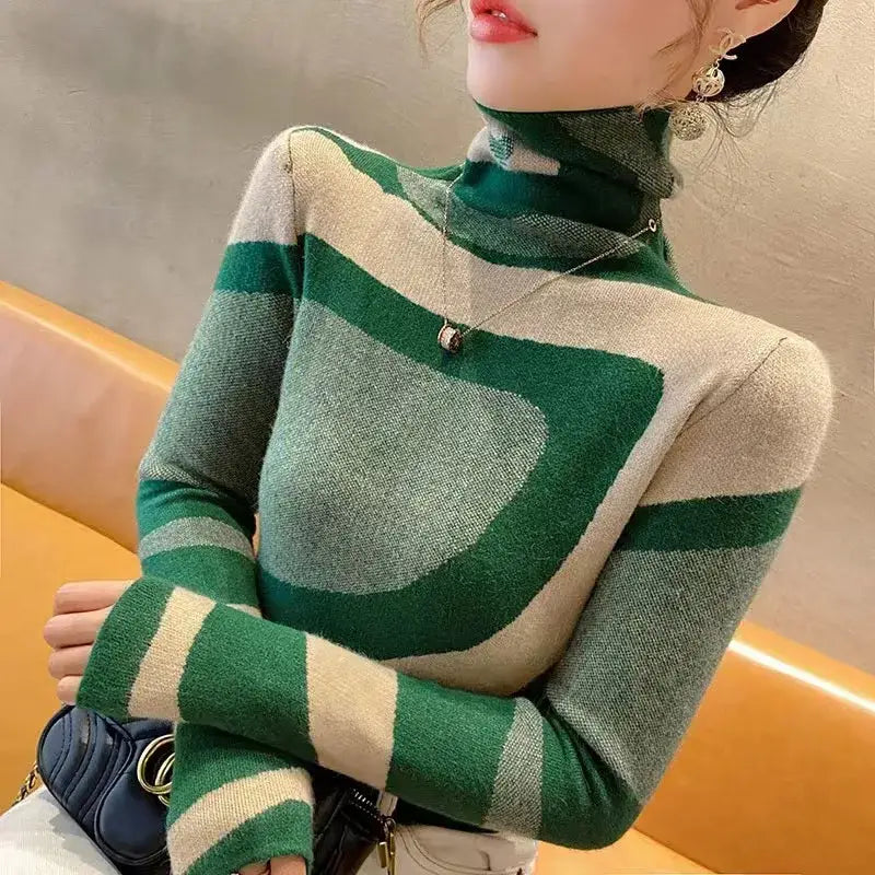 Green and cream color-blocked wool turtleneck sweater with geometric patterns