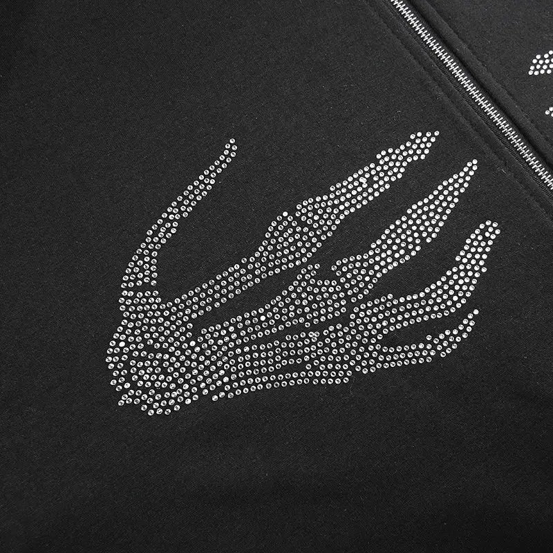 Skeletal hand design with rhinestones on Y2K aesthetic hoodies dark fabric