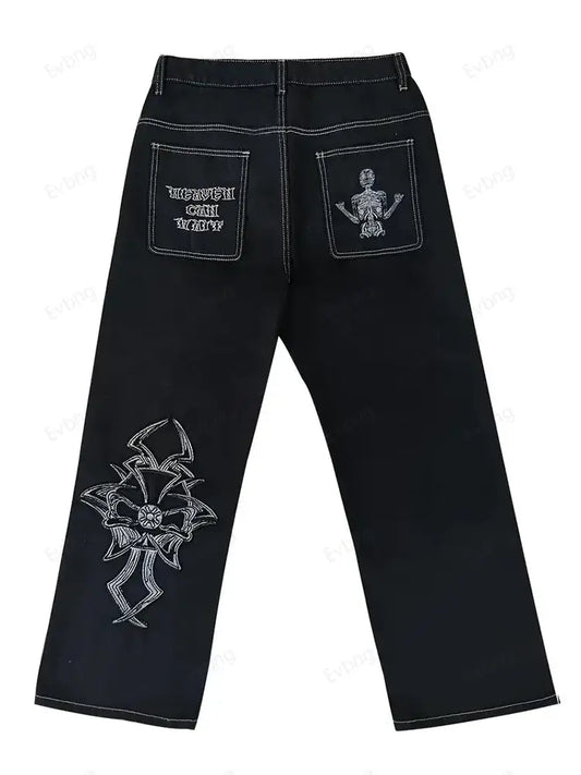 Y2K black jeans featuring decorative skeleton designs on pockets and leg