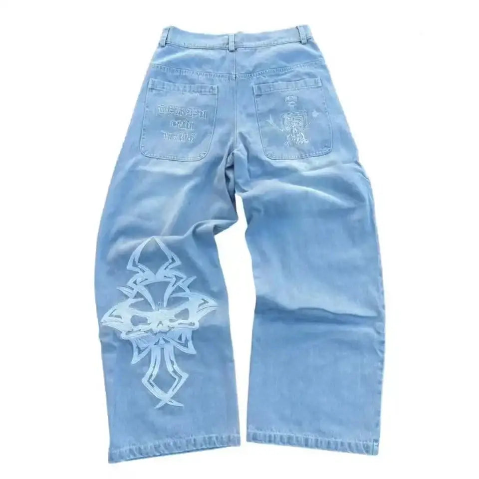 Light blue Y2K jeans featuring a decorative cross design on one leg for trendy style