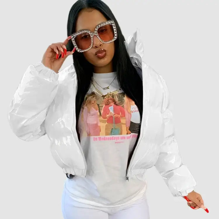 Woman in oversized sunglasses sports a Y2K cropped jacket over a graphic t-shirt