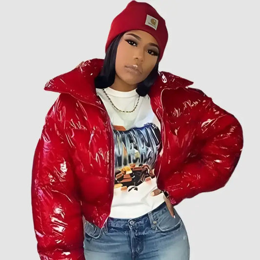 Woman in a red puffer jacket and beanie featuring a stylish Y2K cropped design