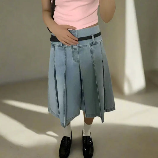 Pleated Y2K Denim Skirt styled with a black belt, white socks, and black shoes