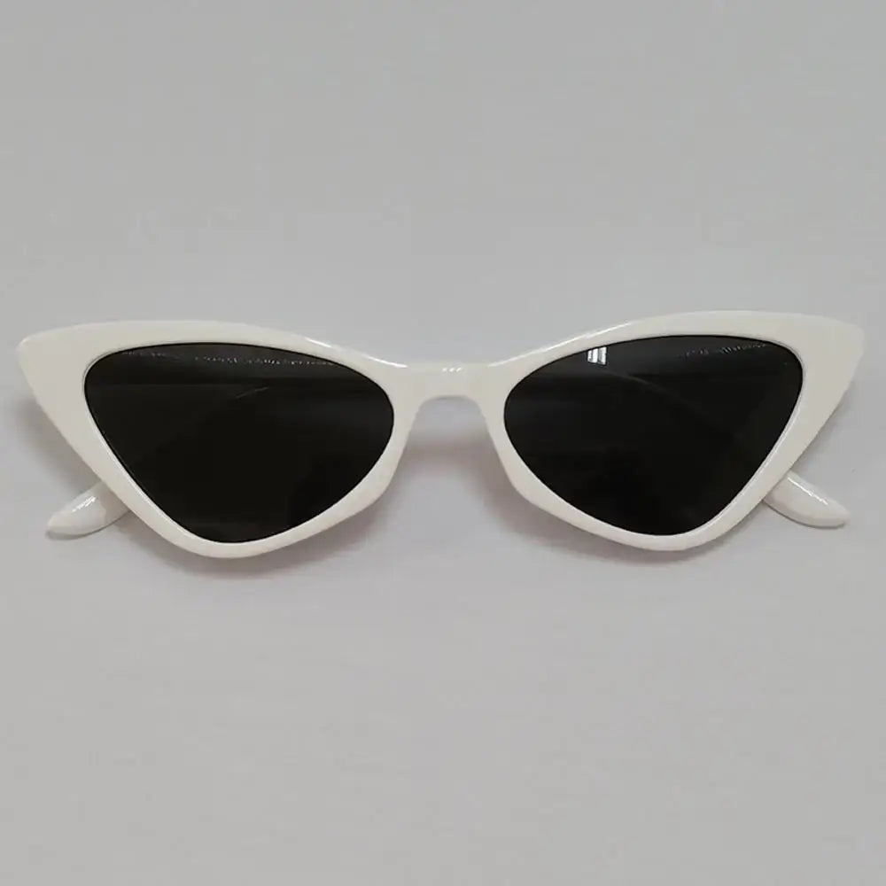 White cat-eye sunglasses with dark lenses for trendy Y2K fashion sunglasses look