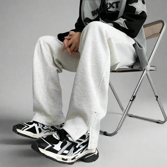 Pair of black and white geometric patterned sneakers with Y2K flare pants outfit