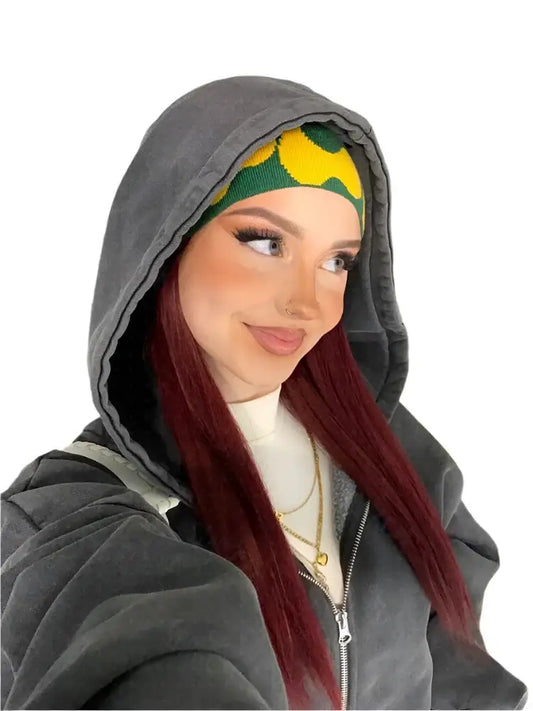 Woman in a Y2K Grey Hoodie with a yellow and green patterned headband