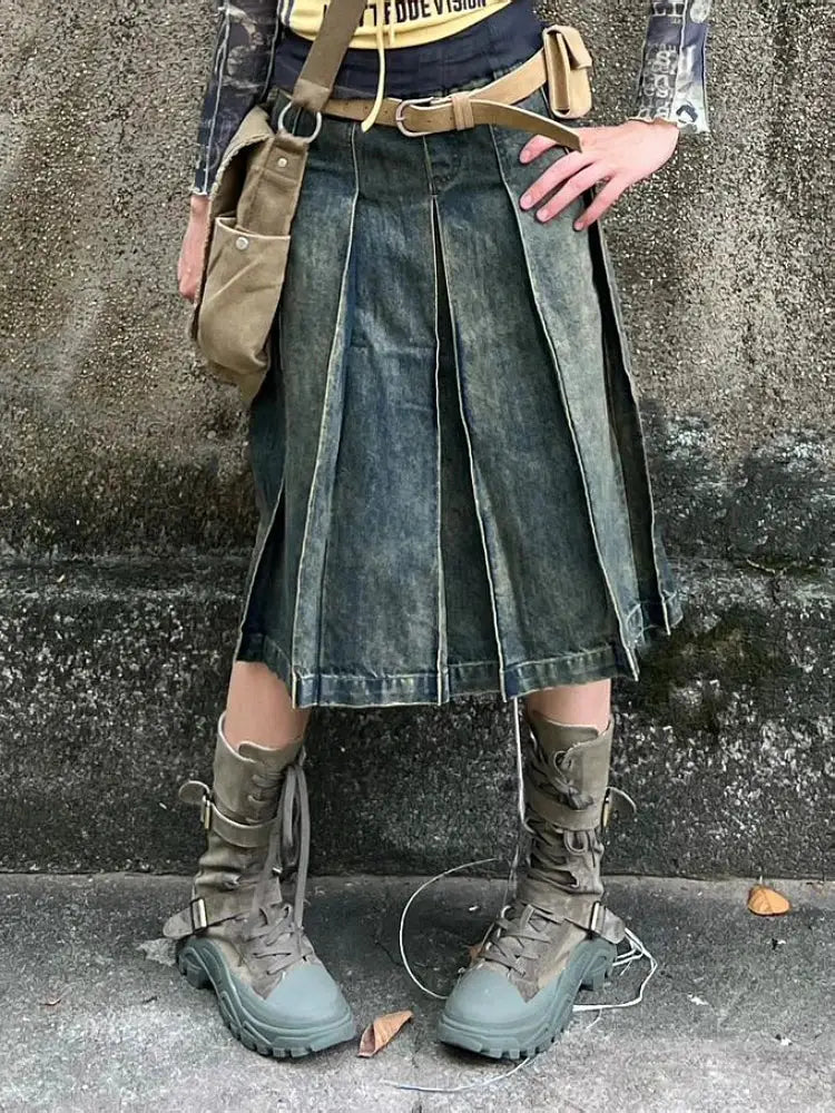 Pleated Y2K Jean Skirt styled with a tool belt and rugged boots for a trendy look