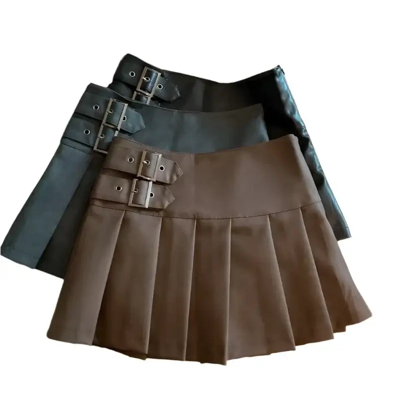 Pleated Y2K Leather Skirt in black and brown with stylish buckle details