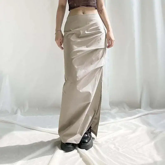 Y2K Long Skirt in sleek satin, featuring a side slit and paired with black shoes