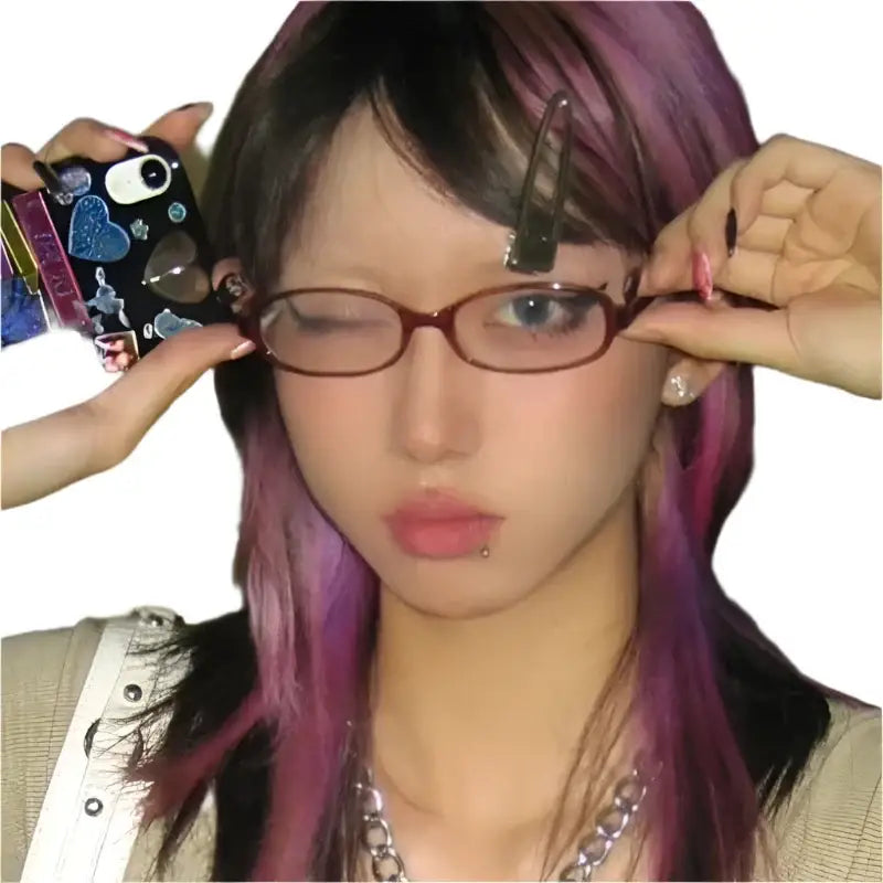 Lifelike doll head with purple hair adjusting Y2K Oval Glasses for a trendy look