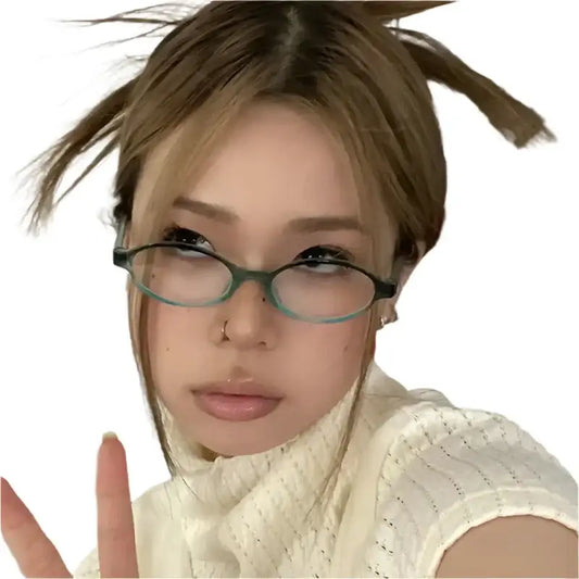 Young woman in white top showcasing Y2K Oval Glasses with messy updo hairstyle