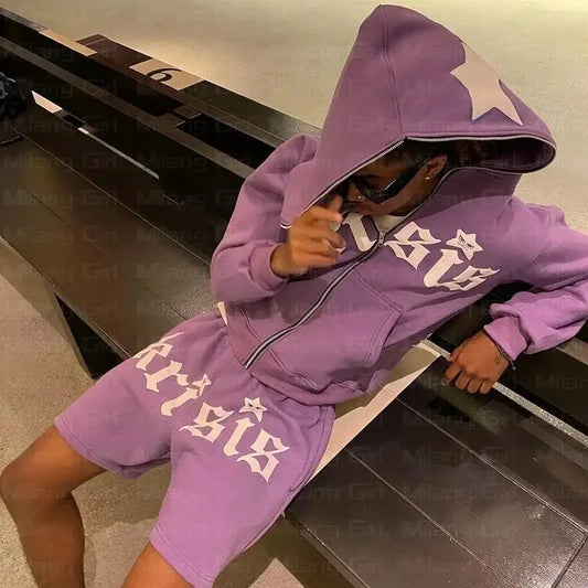 Person wearing a Y2K Purple Hoodie with white text on a vibrant purple background