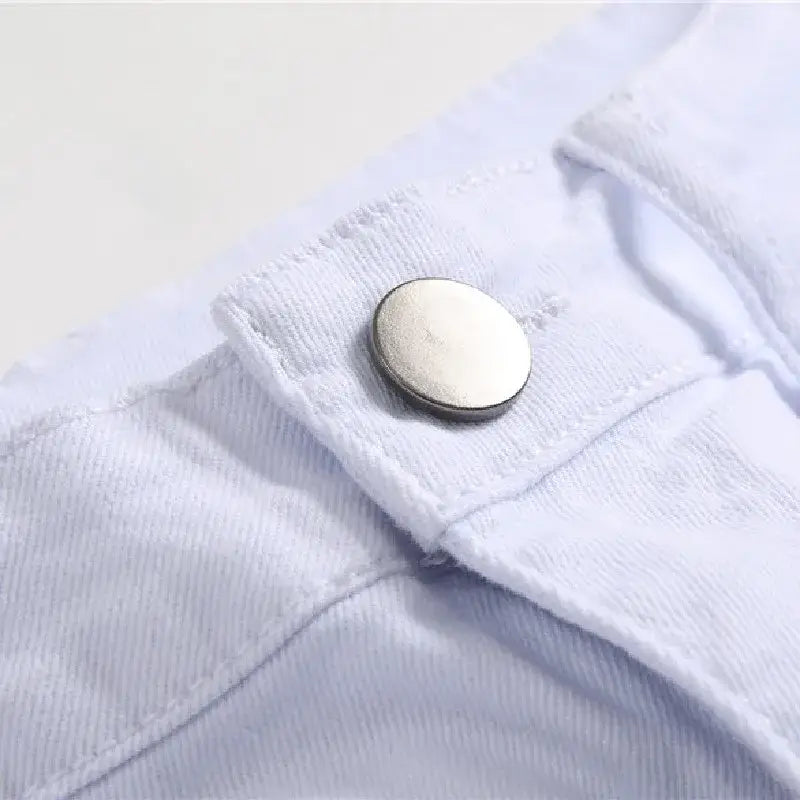 White button detail on fabric cuff of Y2K Skinny Jeans for a stylish look