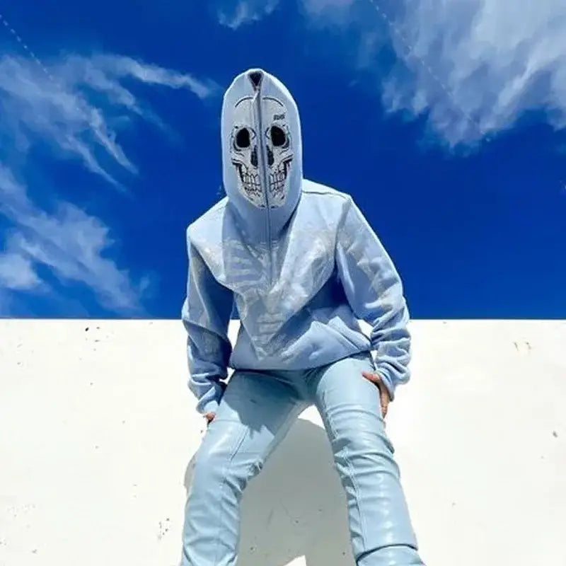 Person in a white skull mask and light-colored outfit showcasing Y2K Skull Hoodie