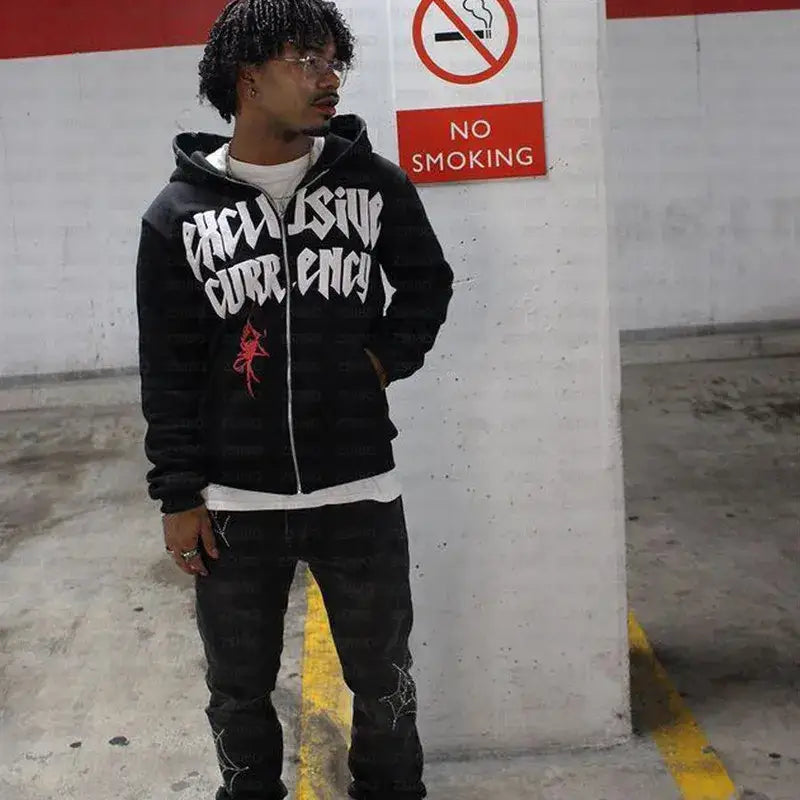 Young man in Y2K Spider Hoodie with graffiti near a No Smoking sign