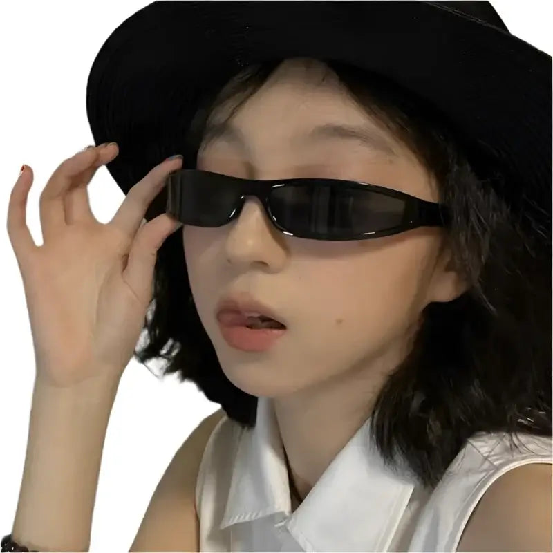 Person sporting black hat and sunglasses with Y2K Square Glasses for a trendy look