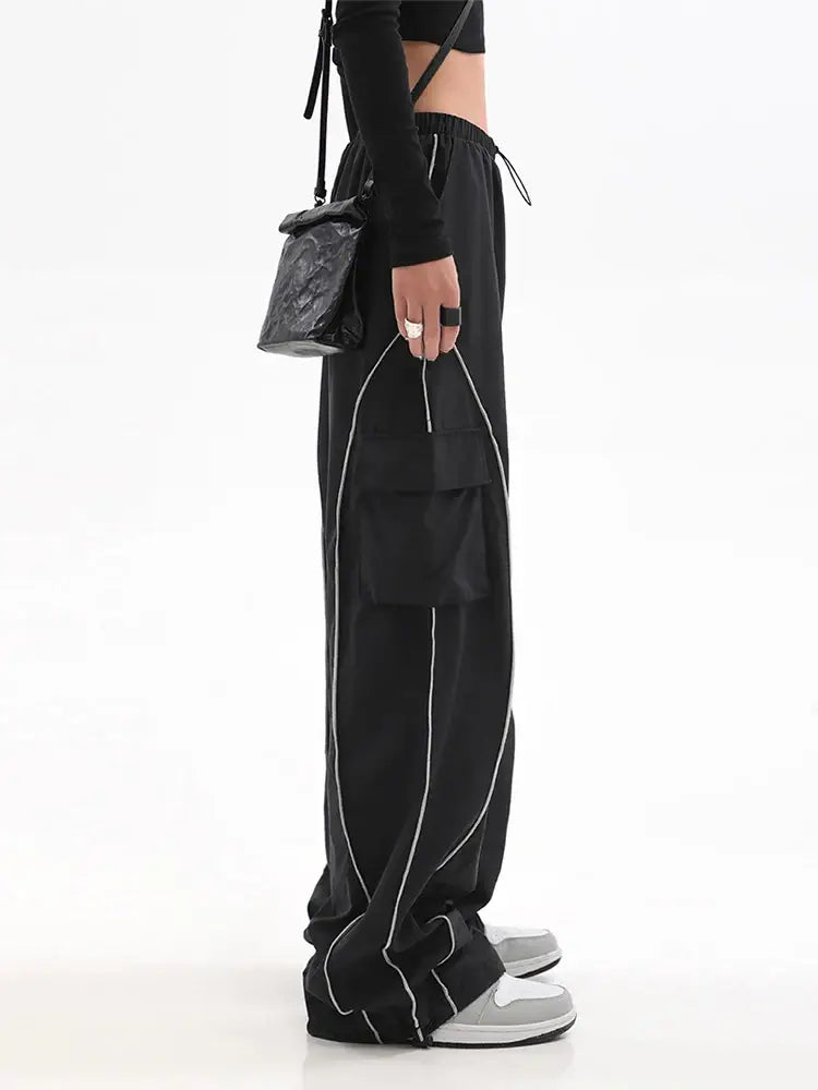 Black Y2K Track Pants with white piping along the seams for a stylish look