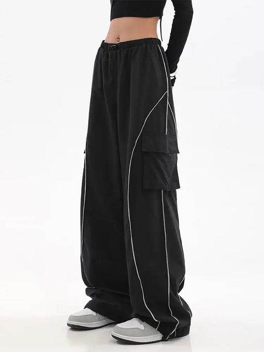 Wide-leg Y2K track pants with white piping and tiered layers for a stylish look