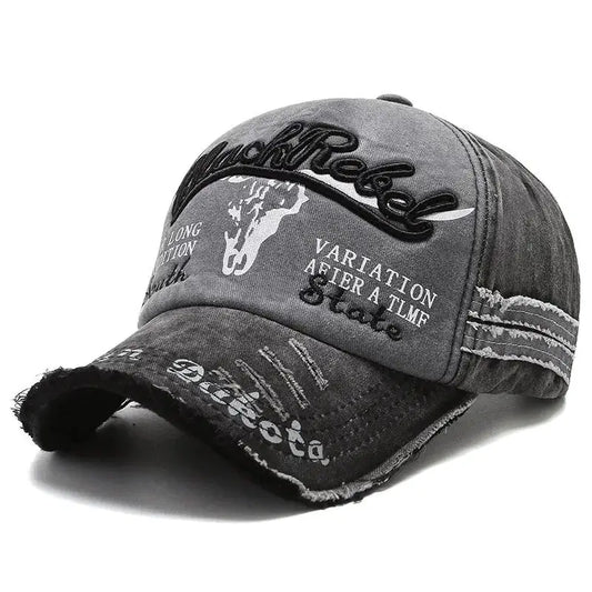 Distressed gray Y2K trucker cap with embroidered bull skull design and trendy text