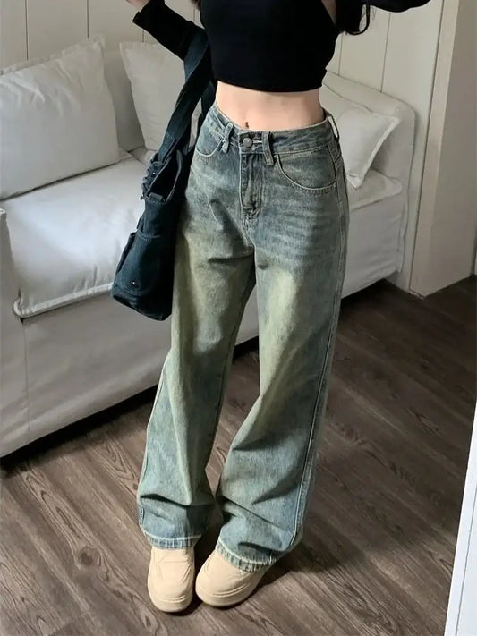 Pair of loose-fitting light blue Y2K Washed Jeans styled with a black crop top