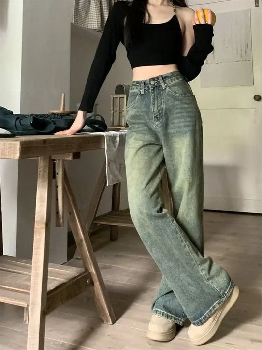 Wide-leg green Y2K Washed Jeans styled with a black crop top and white sneakers